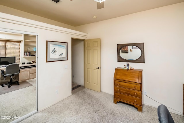 bedroom with ceiling fan and light carpet