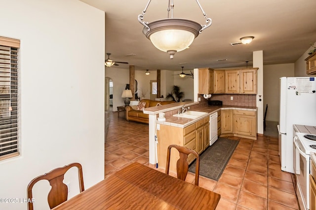 kitchen featuring light tile patterned floors, a ceiling fan, white appliances, and light brown cabinetry