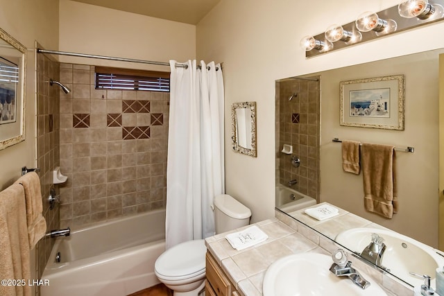 bathroom featuring toilet, vanity, and shower / tub combo with curtain