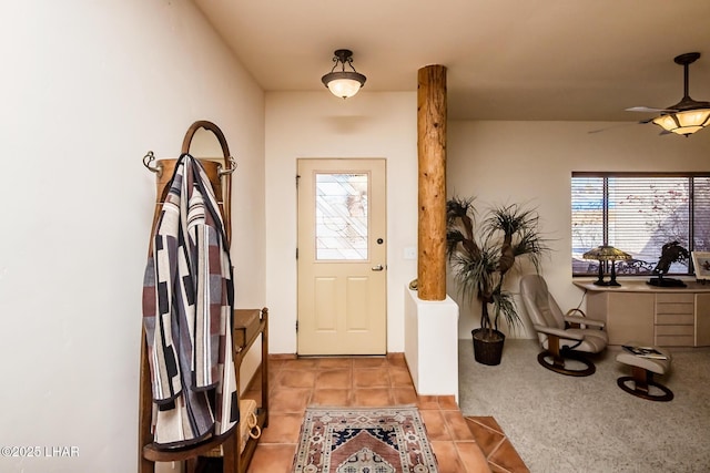 entryway with light carpet and light tile patterned floors