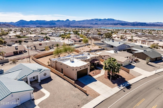 birds eye view of property featuring a mountain view and a residential view