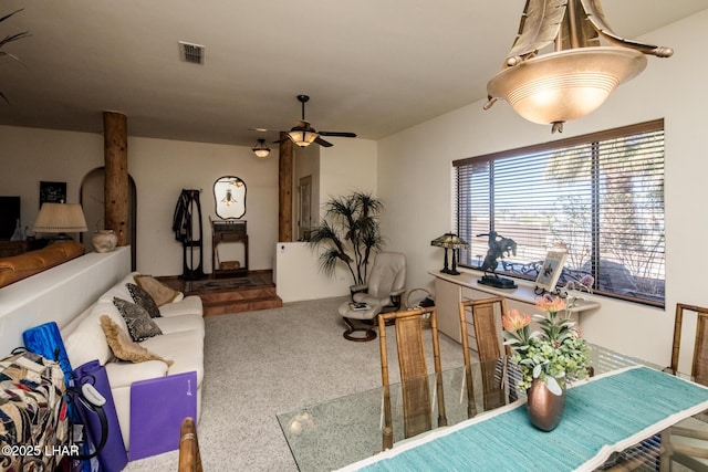 interior space featuring carpet floors and ceiling fan