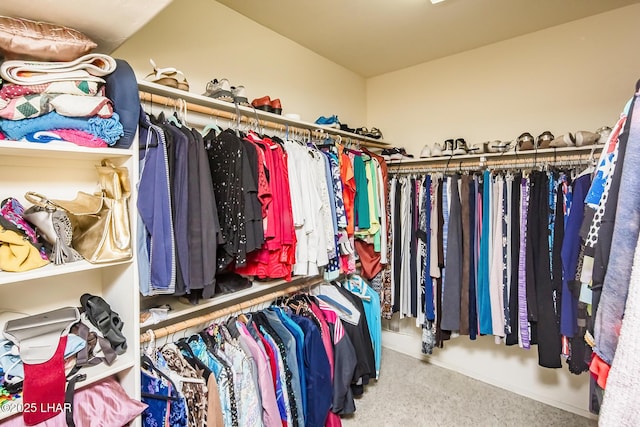 walk in closet featuring carpet