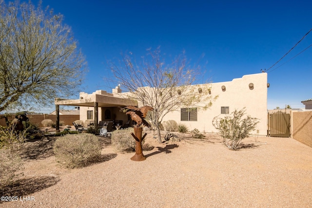 rear view of house featuring a patio area