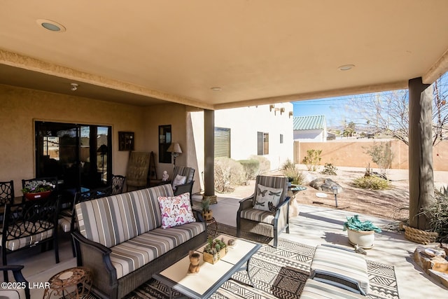 view of patio / terrace with outdoor lounge area and fence