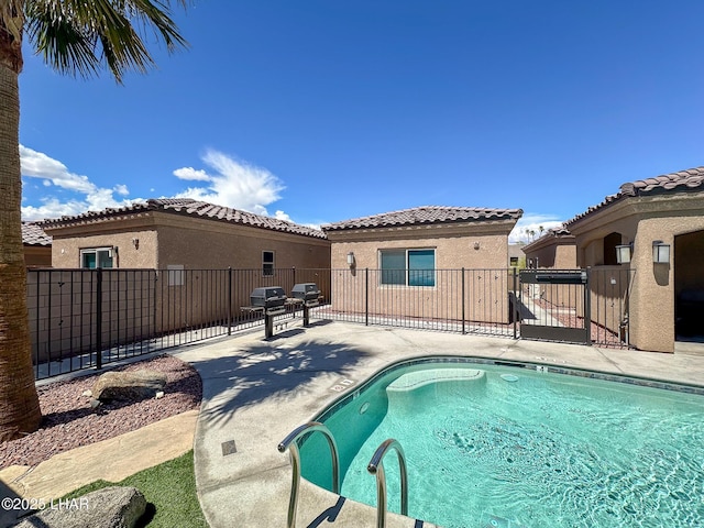490 N Lake Havasu Ave Unit J, Lake Havasu City, AZ 86403 - view of pool featuring fence, a patio, and grilling area
