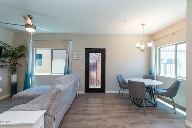 490 N Lake Havasu Ave Unit J, Lake Havasu City, AZ 86403 - dining room with a chandelier, wood finished floors, and baseboards