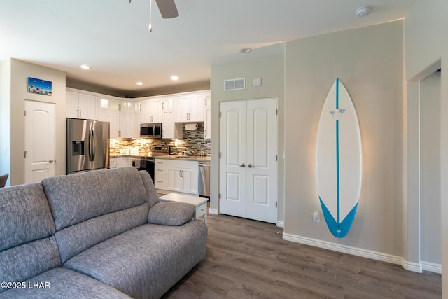 490 N Lake Havasu Ave Unit J, Lake Havasu City, AZ 86403 - living room featuring baseboards, dark wood finished floors, a ceiling fan, and recessed lighting