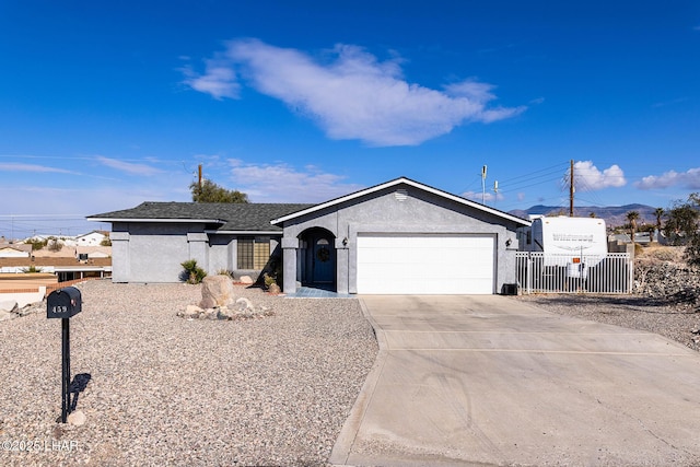 ranch-style house featuring a garage