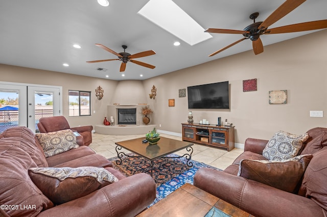 3370 Thunderhead Dr, Lake Havasu City, AZ 86406 - living room featuring a ceiling fan, recessed lighting, a skylight, light tile patterned flooring, and french doors