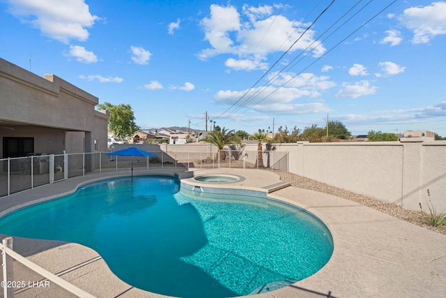 3370 Thunderhead Dr, Lake Havasu City, AZ 86406 - view of swimming pool featuring a fenced backyard, a patio, and a pool with connected hot tub