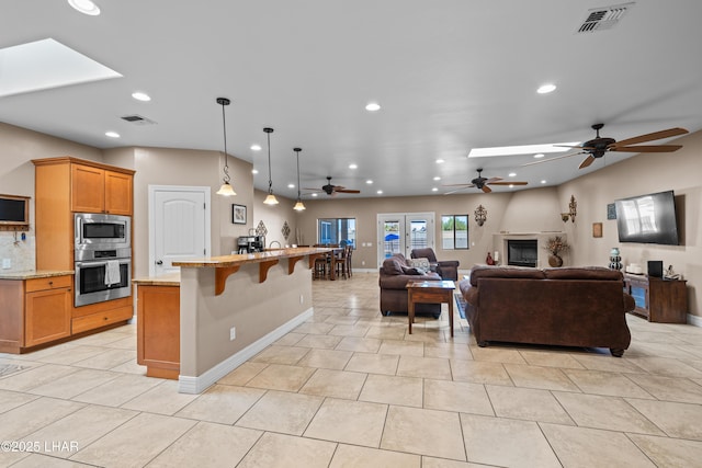 3370 Thunderhead Dr, Lake Havasu City, AZ 86406 - kitchen with appliances with stainless steel finishes, recessed lighting, a ceiling fan, open floor plan, and light stone counters