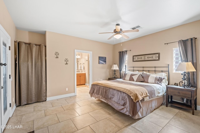 3370 Thunderhead Dr, Lake Havasu City, AZ 86406 - bedroom with a ceiling fan, light tile patterned flooring, and connected bathroom