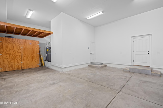 3370 Thunderhead Dr, Lake Havasu City, AZ 86406 - garage featuring electric water heater and baseboards