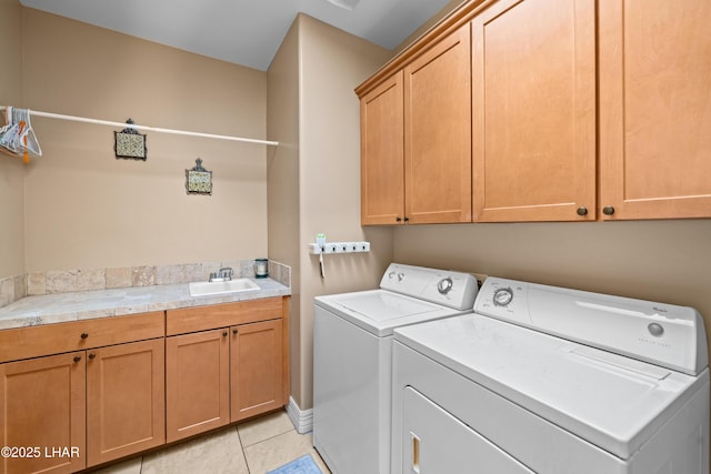 3370 Thunderhead Dr, Lake Havasu City, AZ 86406 - laundry area with cabinet space, washing machine and clothes dryer, and light tile patterned floors