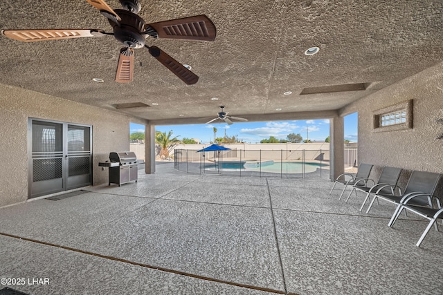 3370 Thunderhead Dr, Lake Havasu City, AZ 86406 - fenced backyard featuring area for grilling, ceiling fan, and a patio