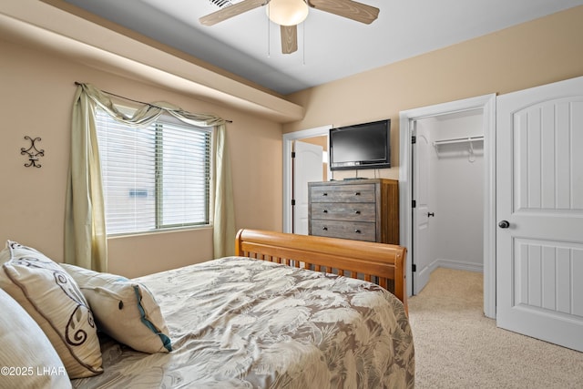 3370 Thunderhead Dr, Lake Havasu City, AZ 86406 - bedroom featuring a walk in closet, light carpet, and a ceiling fan