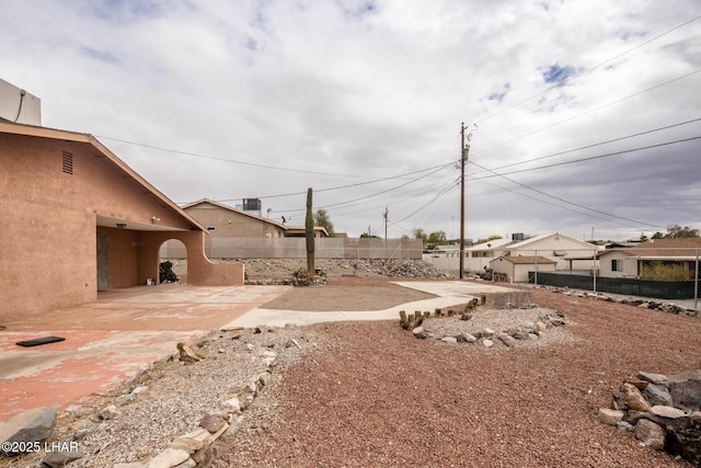 view of yard with a patio and fence