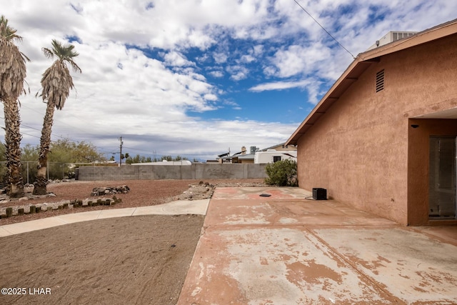 view of yard featuring a patio area and a fenced backyard