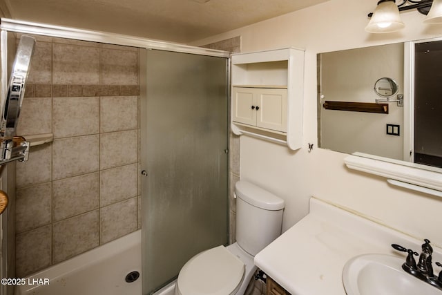 full bath featuring vanity, toilet, and a stall shower