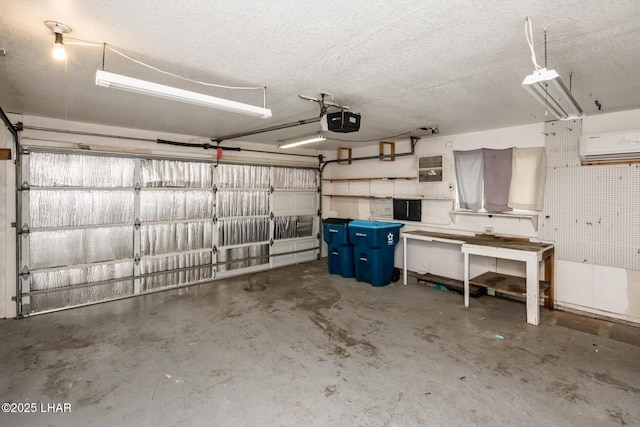 garage with an AC wall unit and a garage door opener