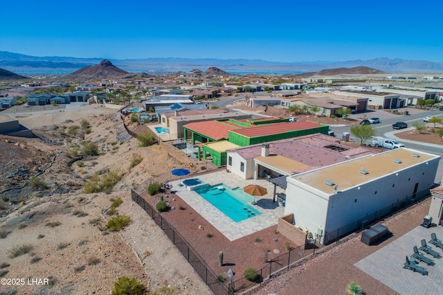 birds eye view of property with a mountain view