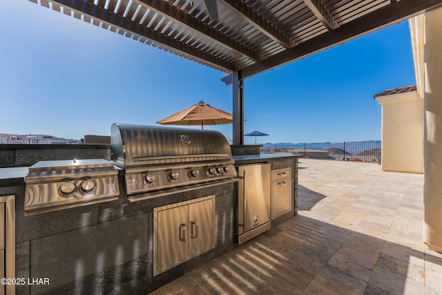 view of patio / terrace featuring fence, area for grilling, and a pergola