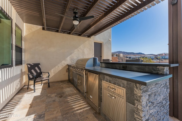 view of patio / terrace with ceiling fan, a mountain view, area for grilling, a grill, and a pergola