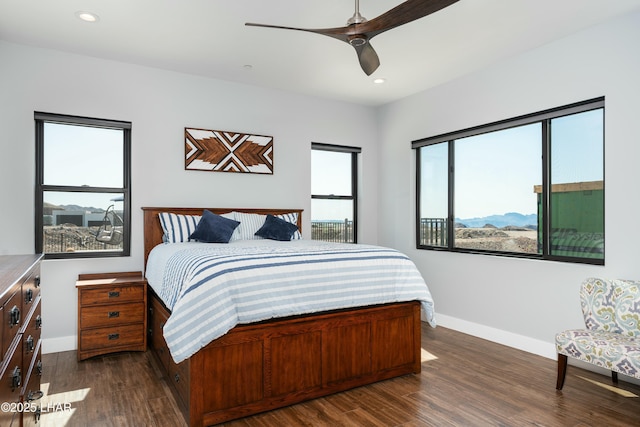 bedroom with a ceiling fan, recessed lighting, dark wood-style floors, and baseboards