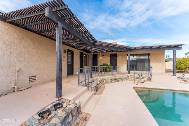 view of swimming pool with a patio area and a pergola