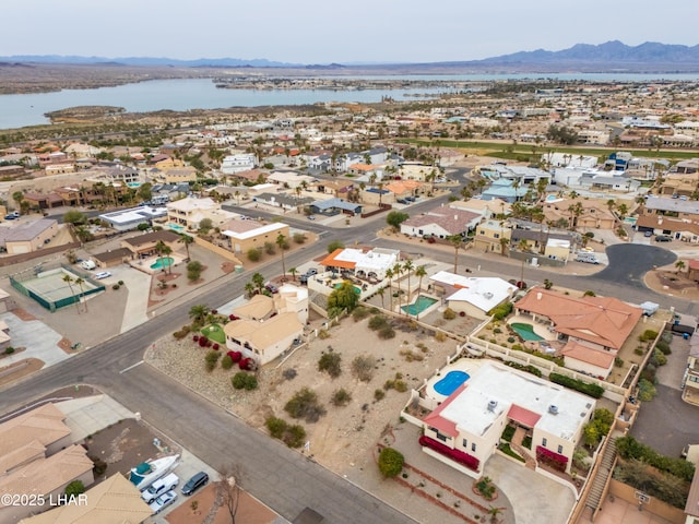 birds eye view of property featuring a water and mountain view