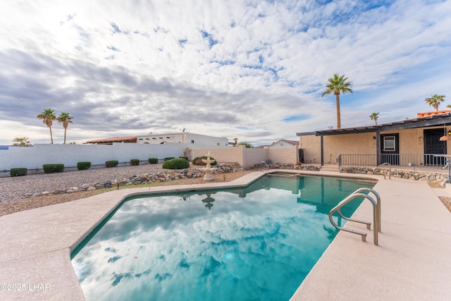 view of swimming pool featuring a patio area