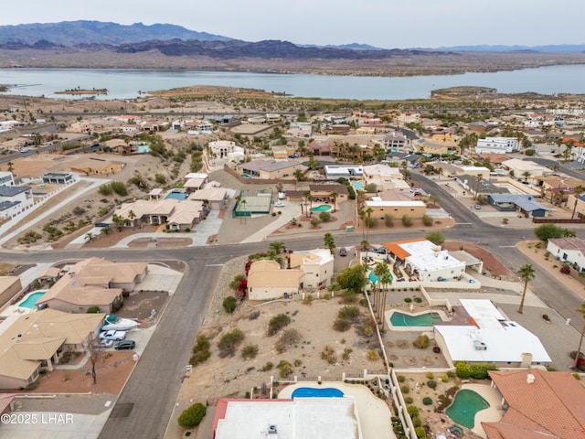 drone / aerial view with a water and mountain view