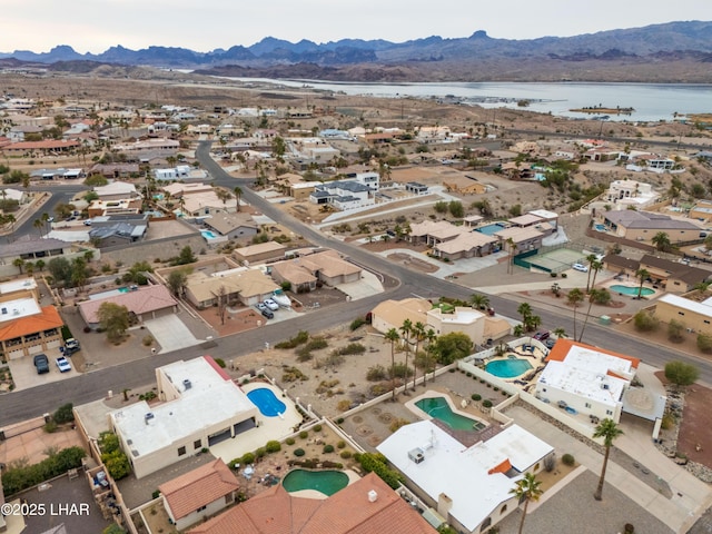 aerial view featuring a water and mountain view