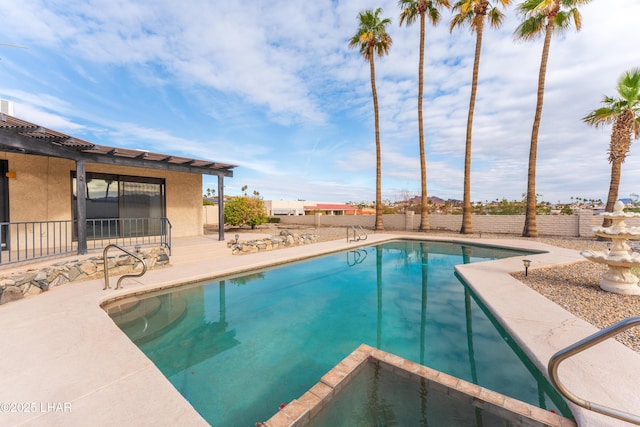 view of swimming pool with a patio area