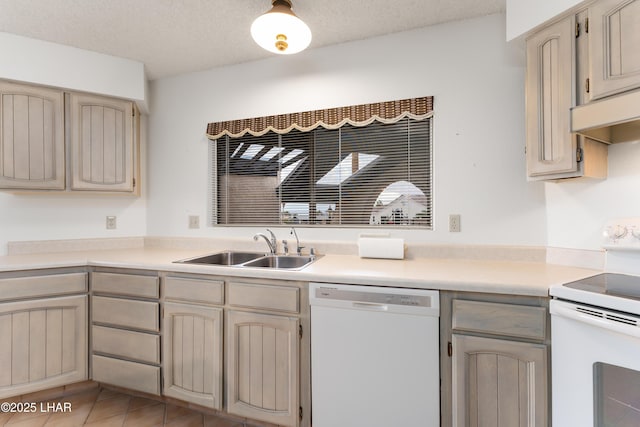 kitchen featuring sink, a textured ceiling, and white appliances