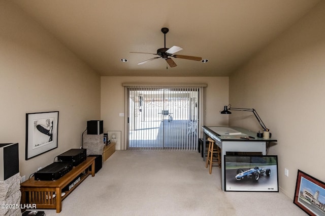 interior space with ceiling fan and carpet flooring