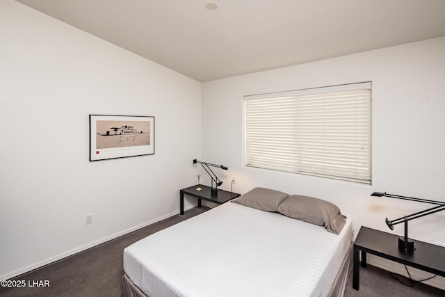 bedroom with carpet floors and baseboards