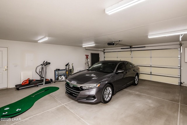 garage featuring a garage door opener