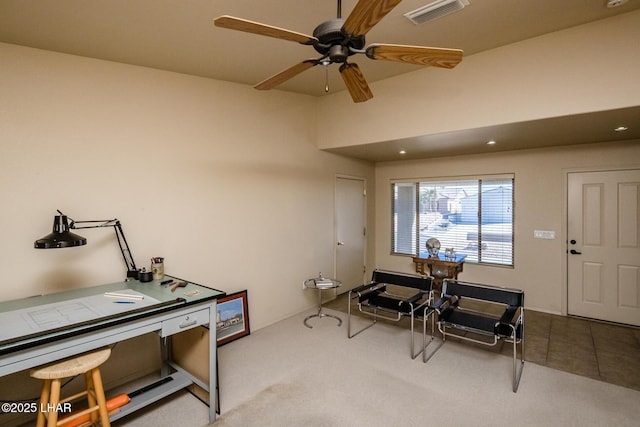 office space featuring ceiling fan, tile patterned flooring, carpet flooring, and visible vents