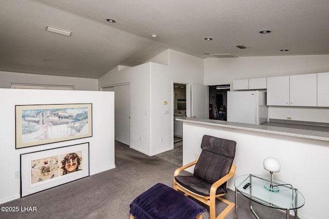 living area with lofted ceiling, visible vents, dark carpet, and recessed lighting