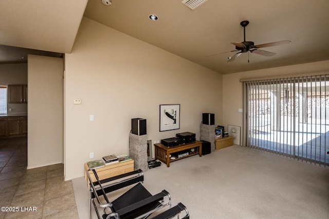 workout room featuring a ceiling fan, lofted ceiling, tile patterned flooring, and visible vents