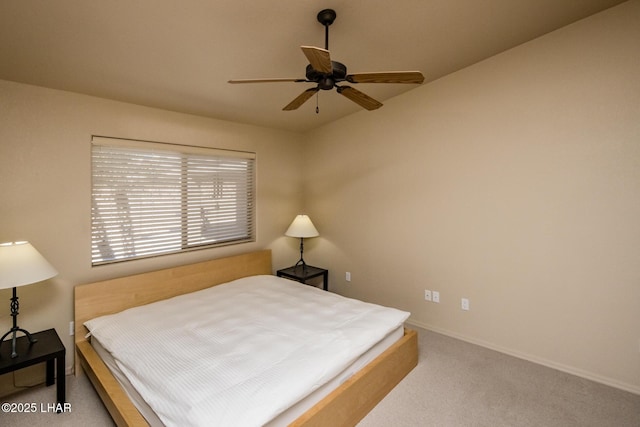 carpeted bedroom featuring ceiling fan and baseboards