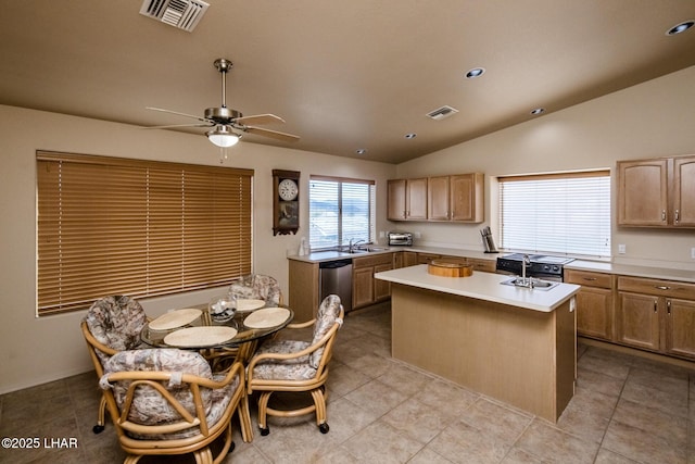 kitchen featuring a center island, visible vents, lofted ceiling, and stainless steel dishwasher