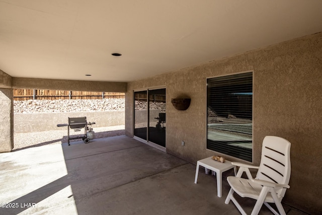 view of patio / terrace featuring fence