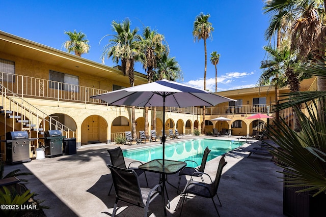 2100 Swanson Ave Unit 201, Lake Havasu City, AZ 86403 - swimming pool featuring a patio, grilling area, and stairway