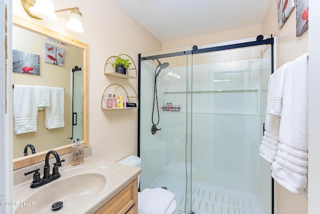 2100 Swanson Ave Unit 201, Lake Havasu City, AZ 86403 - bathroom featuring a stall shower, vanity, and toilet
