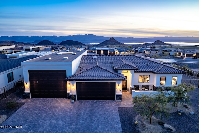 view of front of house with a mountain view and a garage