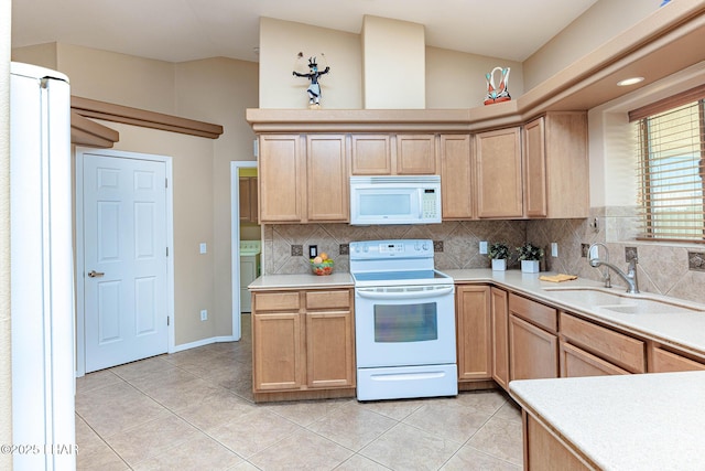2554 Beverly Glen Dr, Lake Havasu City, AZ 86403 - kitchen featuring white appliances, a sink, light brown cabinetry, lofted ceiling, and light tile patterned flooring
