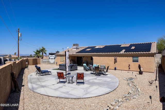 2554 Beverly Glen Dr, Lake Havasu City, AZ 86403 - fenced backyard featuring a patio area, outdoor dining space, and a hot tub